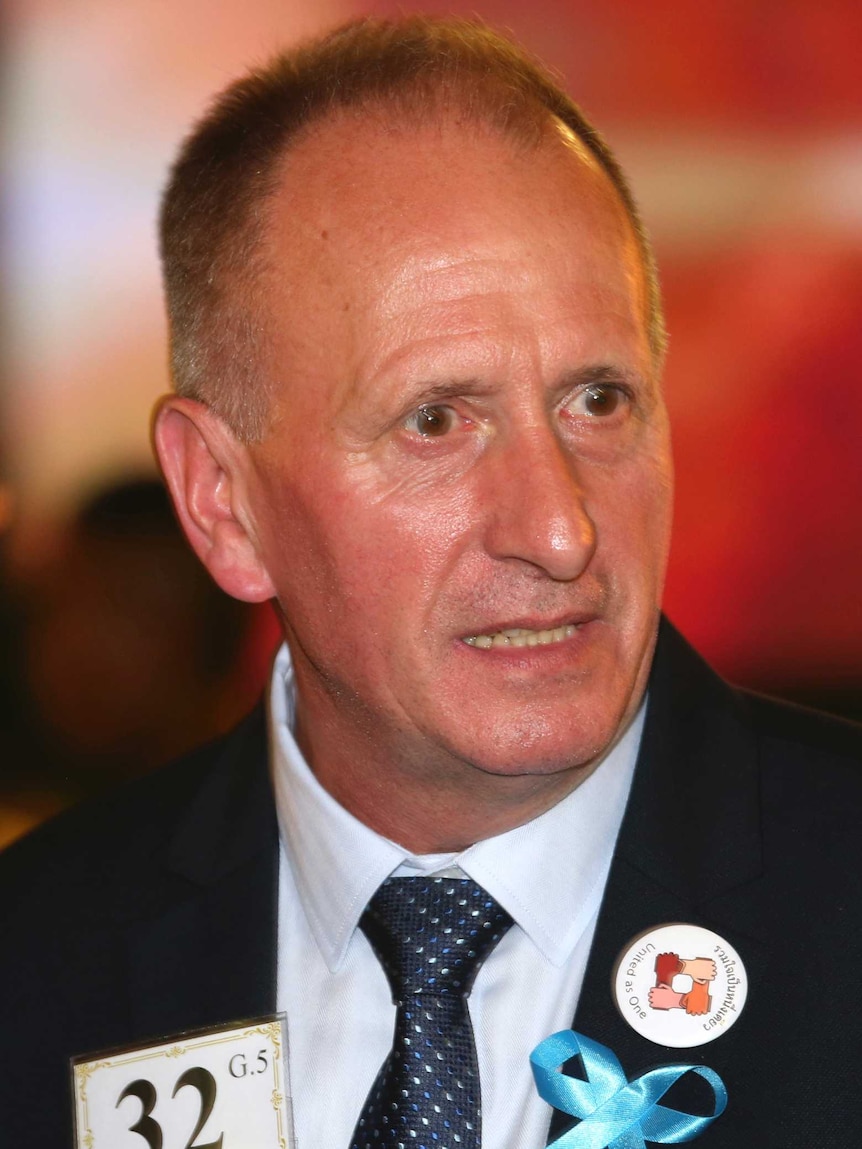 A head and shoulders shot of Vernon Unsworth wearing a suit jacket and tie.