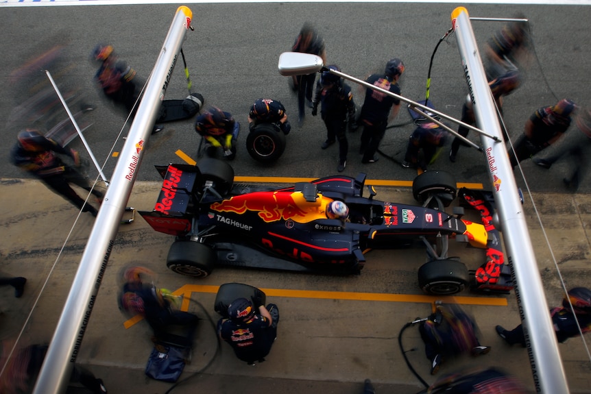 Daniel Ricciardo makes a pit stop during winter testing