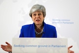 Britain's Prime Minister Theresa May gestures as she delivers a speech in London.
