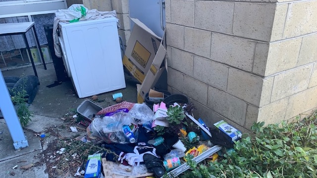 Rubbish outside Glenorchy public housing complex.