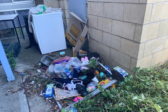 Rubbish outside Glenorchy public housing complex.