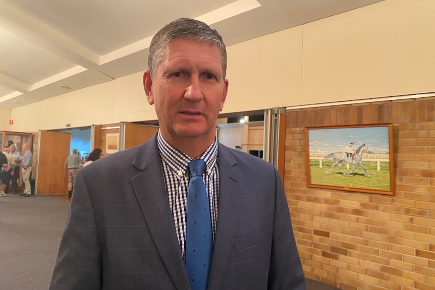 A man wearing a tie and suit