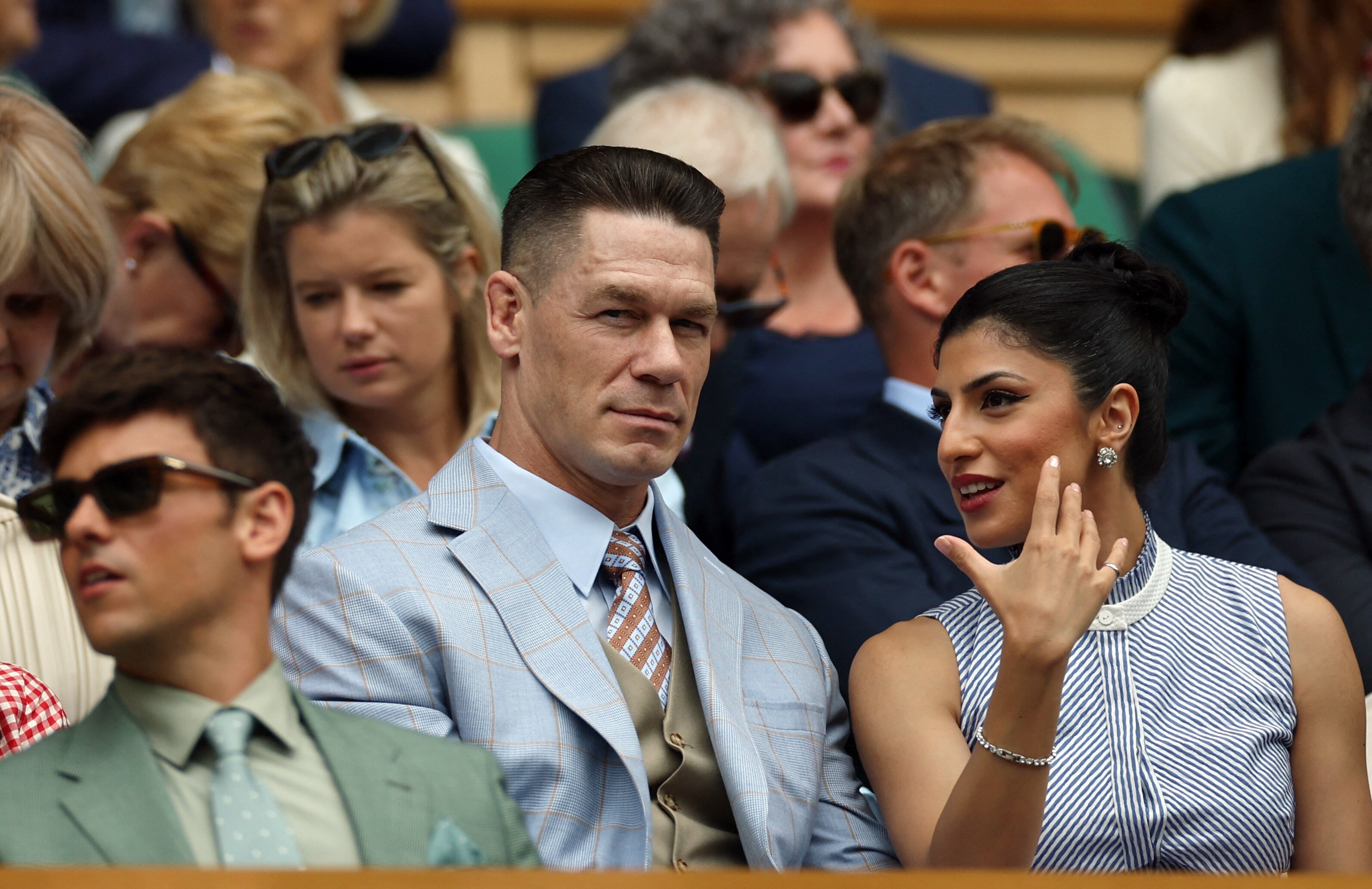 Wrestler turned actor John Cena and his wife Shay Shariatzadeh match each other in baby blue outfits 