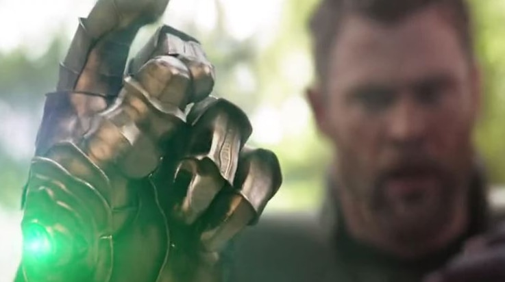 Thor looks on as Thanos snaps his fingers.