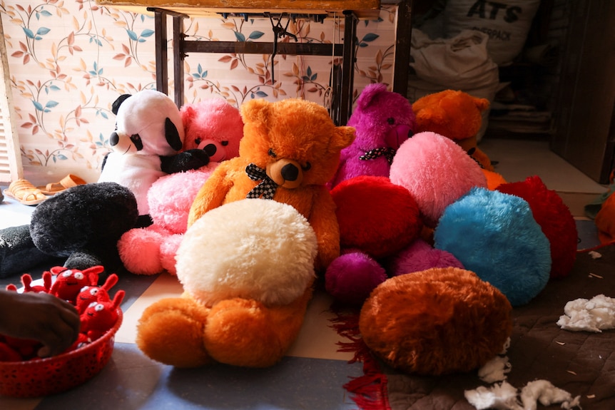 A group of brightly coloured soft toys. 