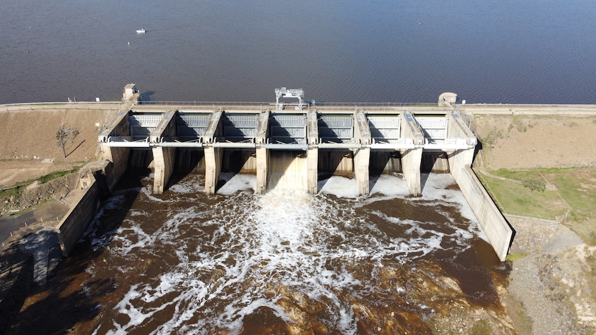 Water spills over dam wall