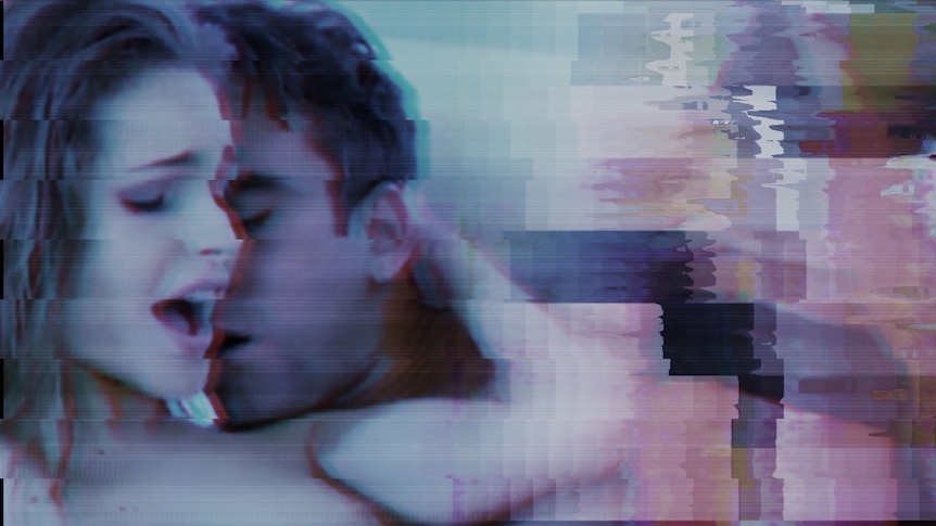 A blurred screenshot of a man nuzzling a woman's neck