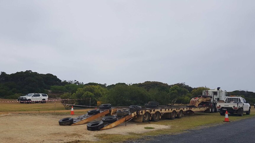 A truck waits at the beach in Hopetoun to transport the whale away.