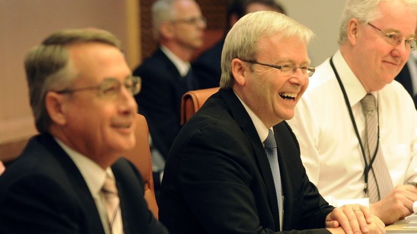 Prime Minister Kevin Rudd (centre) and Federal Treasurer Wayne Swan