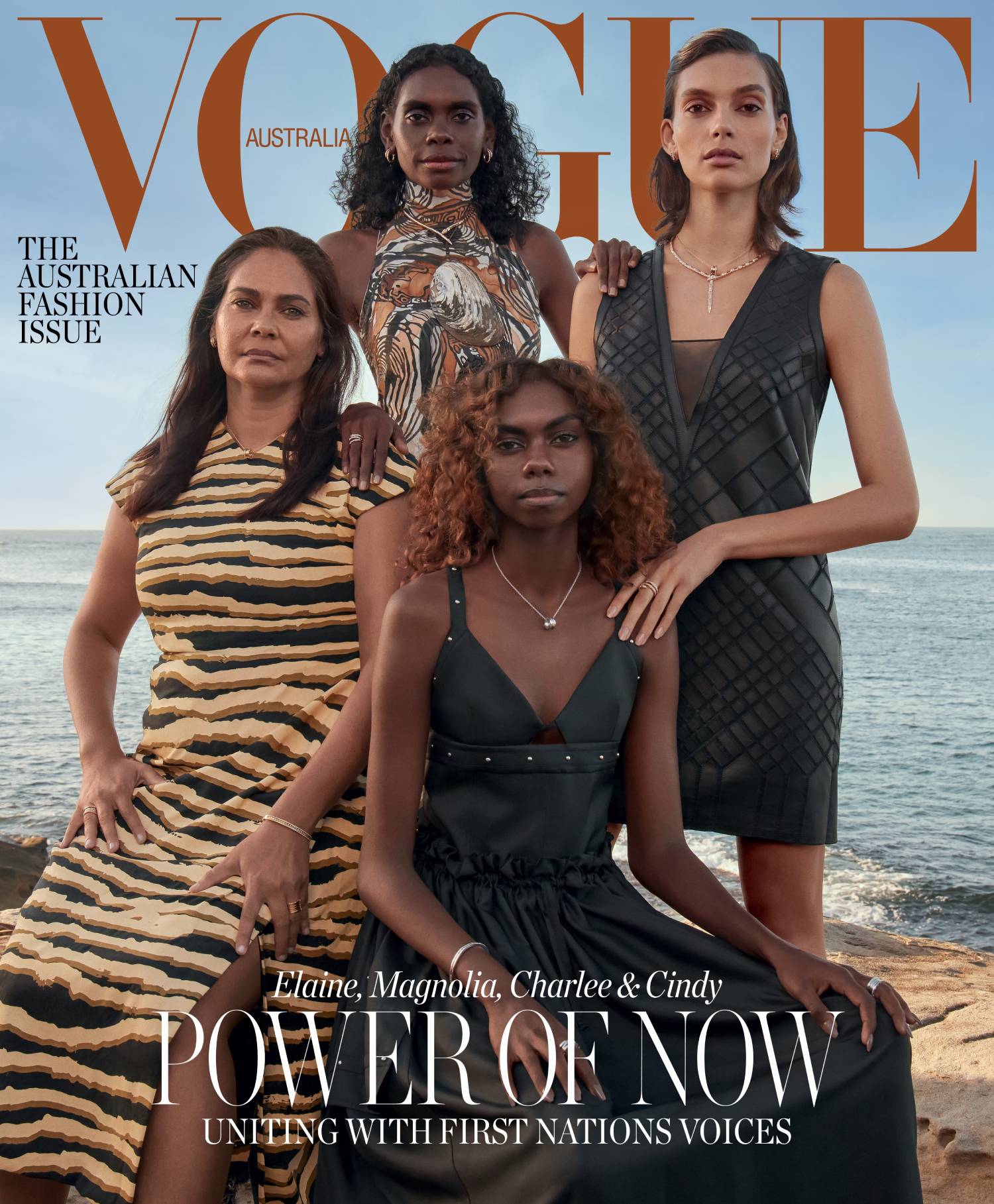 Four women posing on the front cover of a magazine
