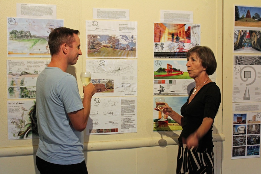 Locals look over the twelve final designs chosen for the Kenilworth Designer Dunny competition.