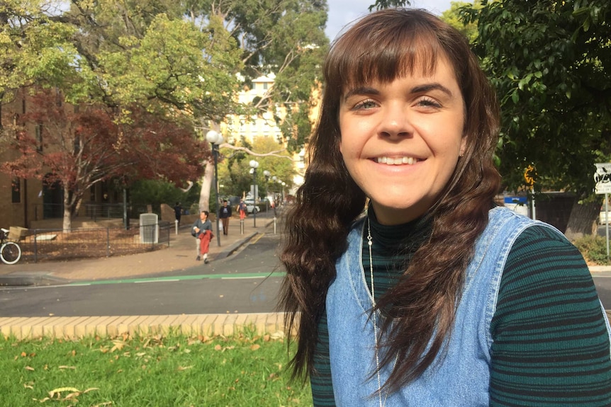 Jess Gordon, a former worker at Burger Buzz, sitting outside.