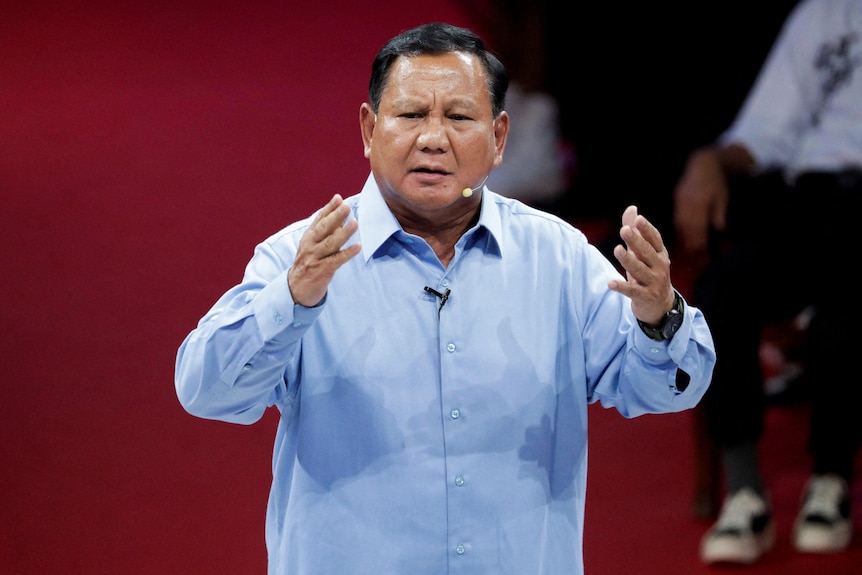 Indonesia's Defence Minister and presidential candidate, Prabowo Subianto, gestures during a televised debate.