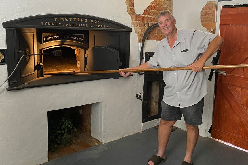 Graeme Wenke in front of an oven