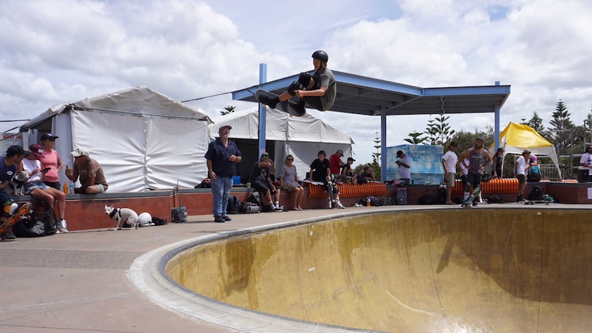 Skateboarder performs a trick in the air