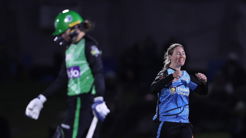 A bowler celebrates getting a batter out.