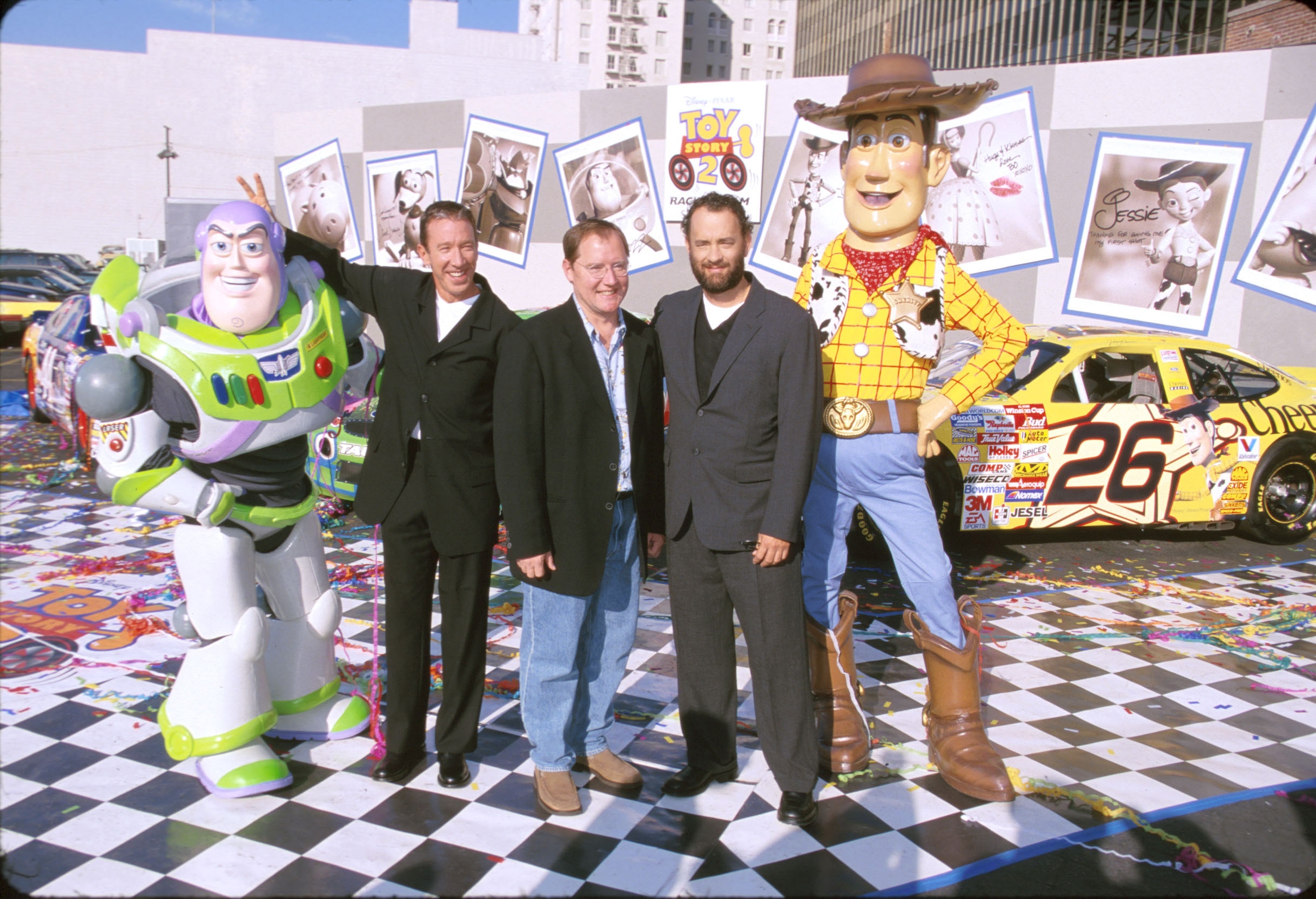 (L-R) Buzz voice actor Tim Allen, John Lasseter and Woody voice actor Tom Hanks promoting Toy Story 2 in 1999.