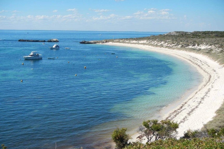A Rottnest Island beach with boats moored nearby