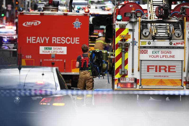 Emergency workers are seen on Bourke street in Melbourne's CBD, Friday, November 9, 2018. 