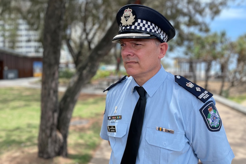 a police officer in uniform at a press conference