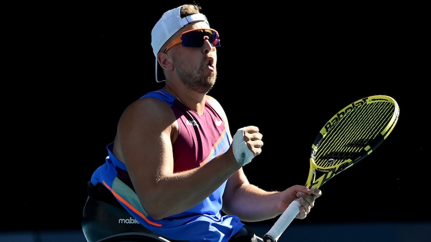 An Australian male tennis player waits for a return during a quad wheelchair singles match.