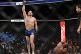 Robert Whittaker celebrates after beating Yoel Romero for the UFC middleweight interim title.