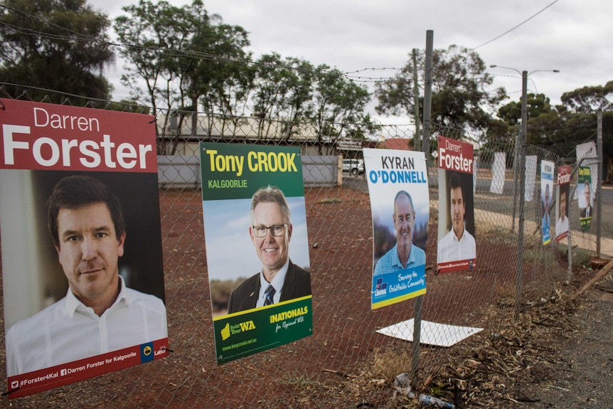 Election posters line a prominent corner in Kalgoorlie-Boulder.