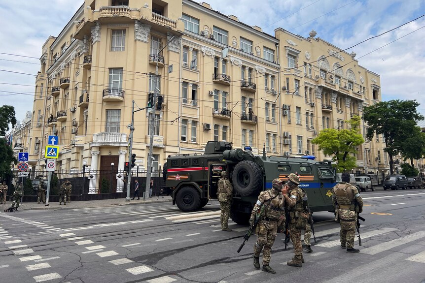 Wagner Group fighters stand guard in a street near the headquarters of the Southern Military District in the city of Rostov-on-Don, Russia, on June 24, 2023.