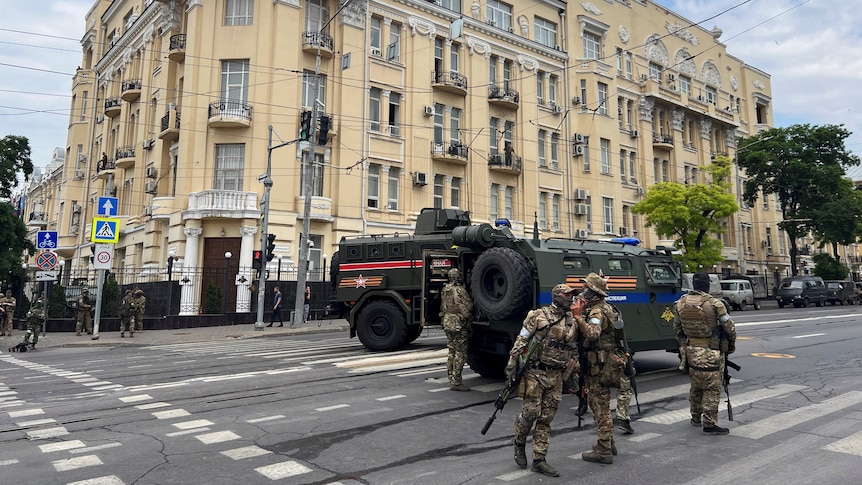 Wagner Group fighters stand guard in a street near the headquarters of the Southern Military District in the city of Rostov-on-Don, Russia, on June 24, 2023.