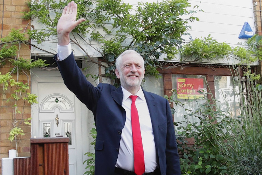 Labour leader Jeremy Corbyn waves as he leaves his leafy home in north London.