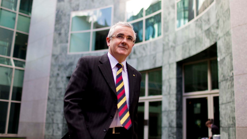 Andrew Wilkie arrives at a press conference