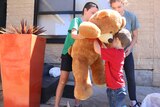 Children with giant bear.