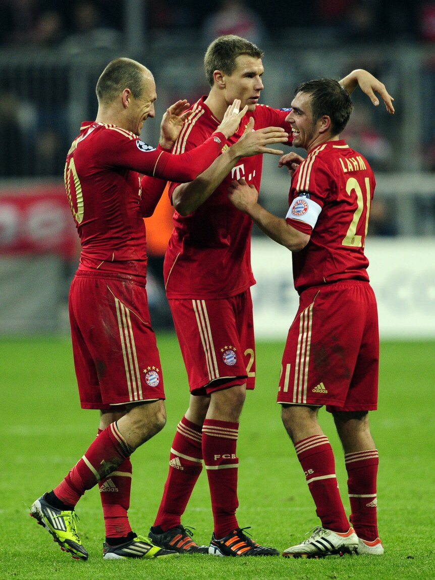 On top ... Bayern Munich's Philipp Lahm, Holger Badstuber and Arjen Robben celebrate their win