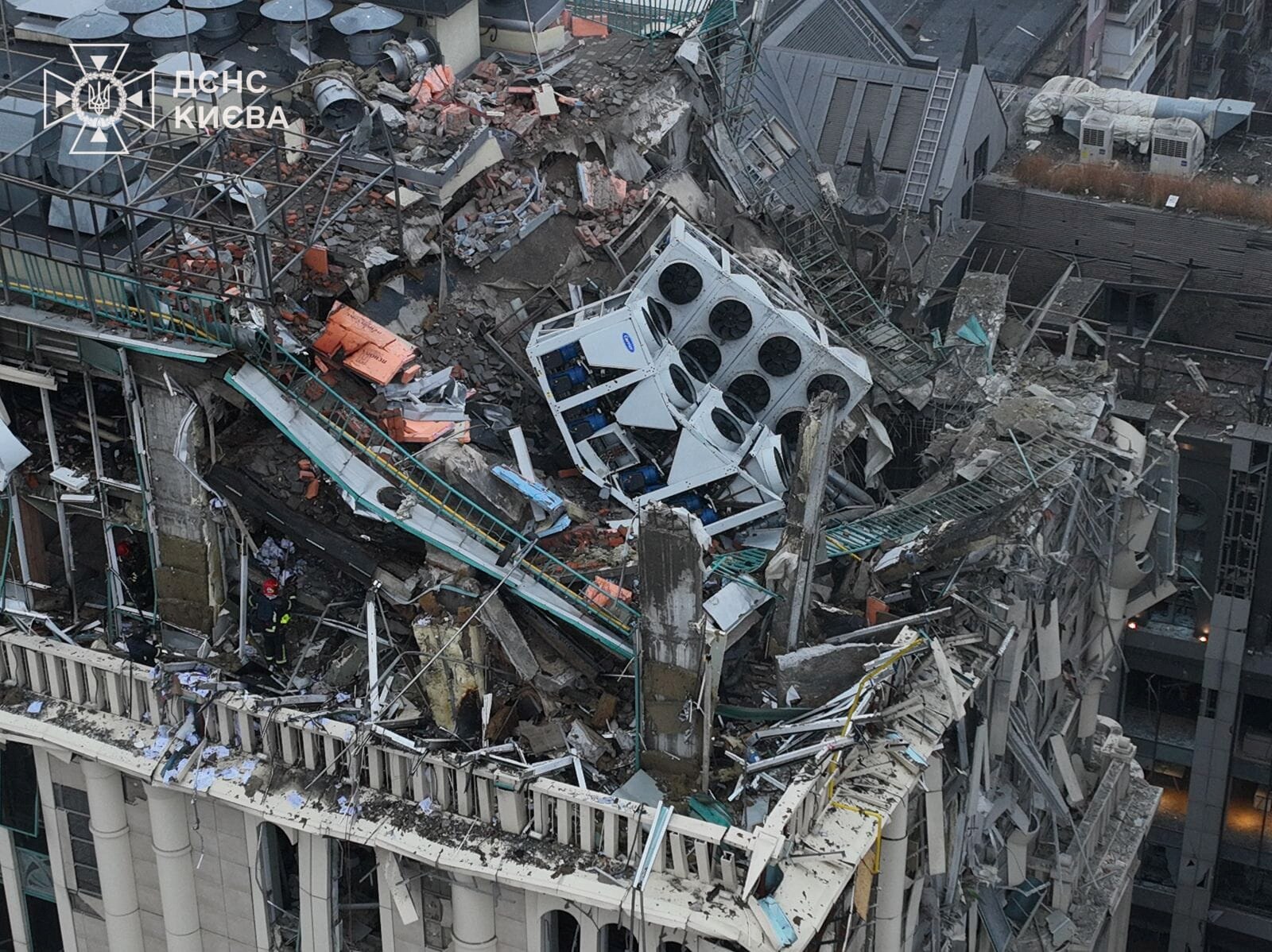 The damaged roof of a multi-storey building in Kyiv, partially collapsed after a missile strike.