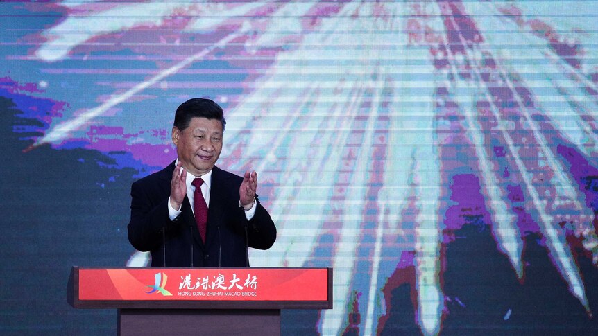 Xi Jinping in front of digital fireworks as he open's world's longest sea bridge.