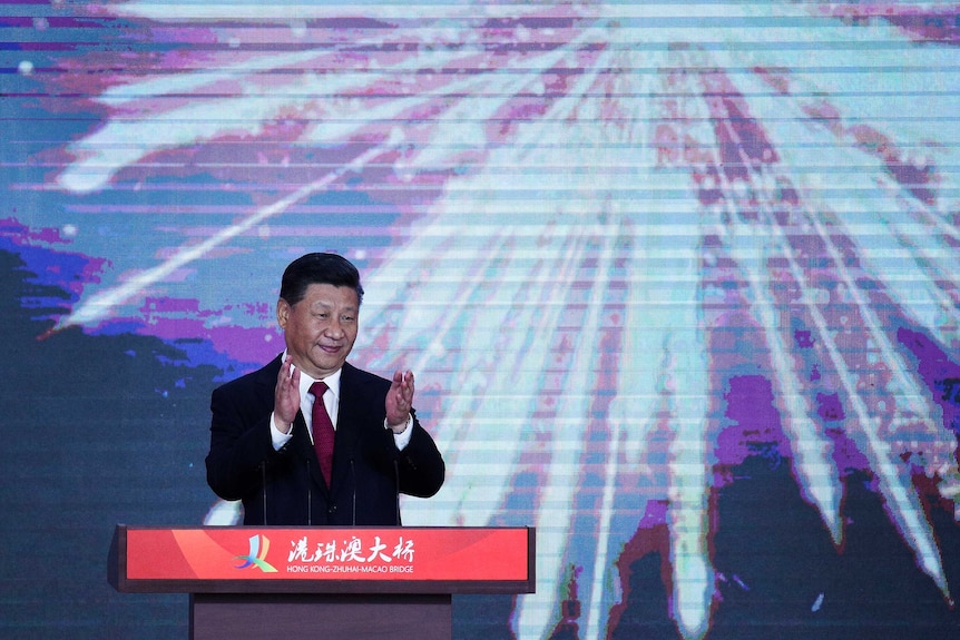 Xi Jinping in front of digital fireworks as he open's world's longest sea bridge.