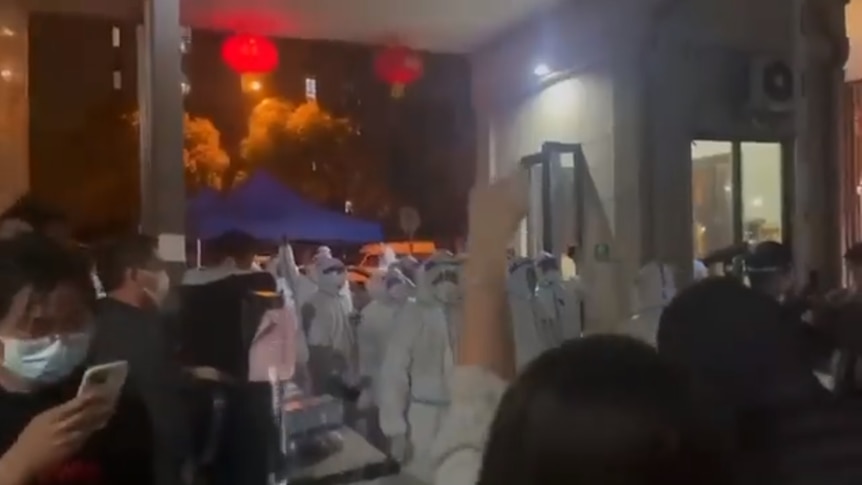 A video posted to social media shows residents of a Shanghai apartment block confront security guards. 