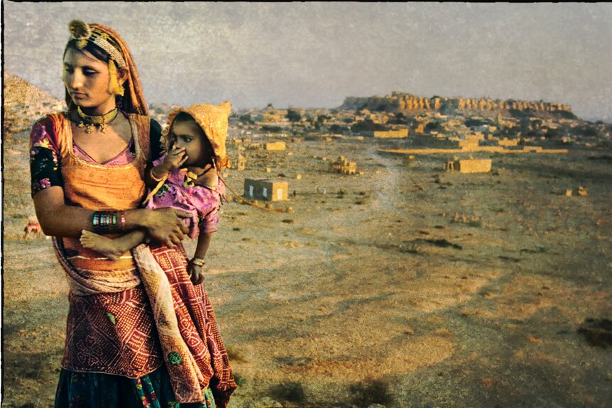 Woman and child late in the day in Jaisalmer India