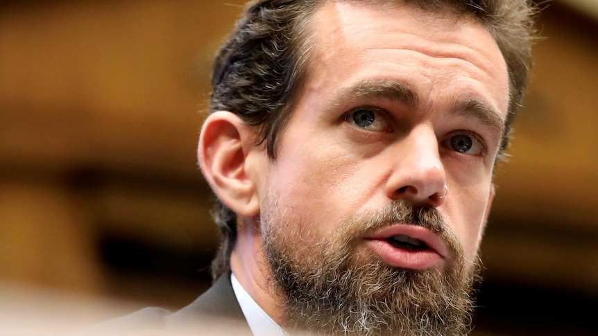 A close-up of Twitter CEO Jack Dorsey looking on in a committee room