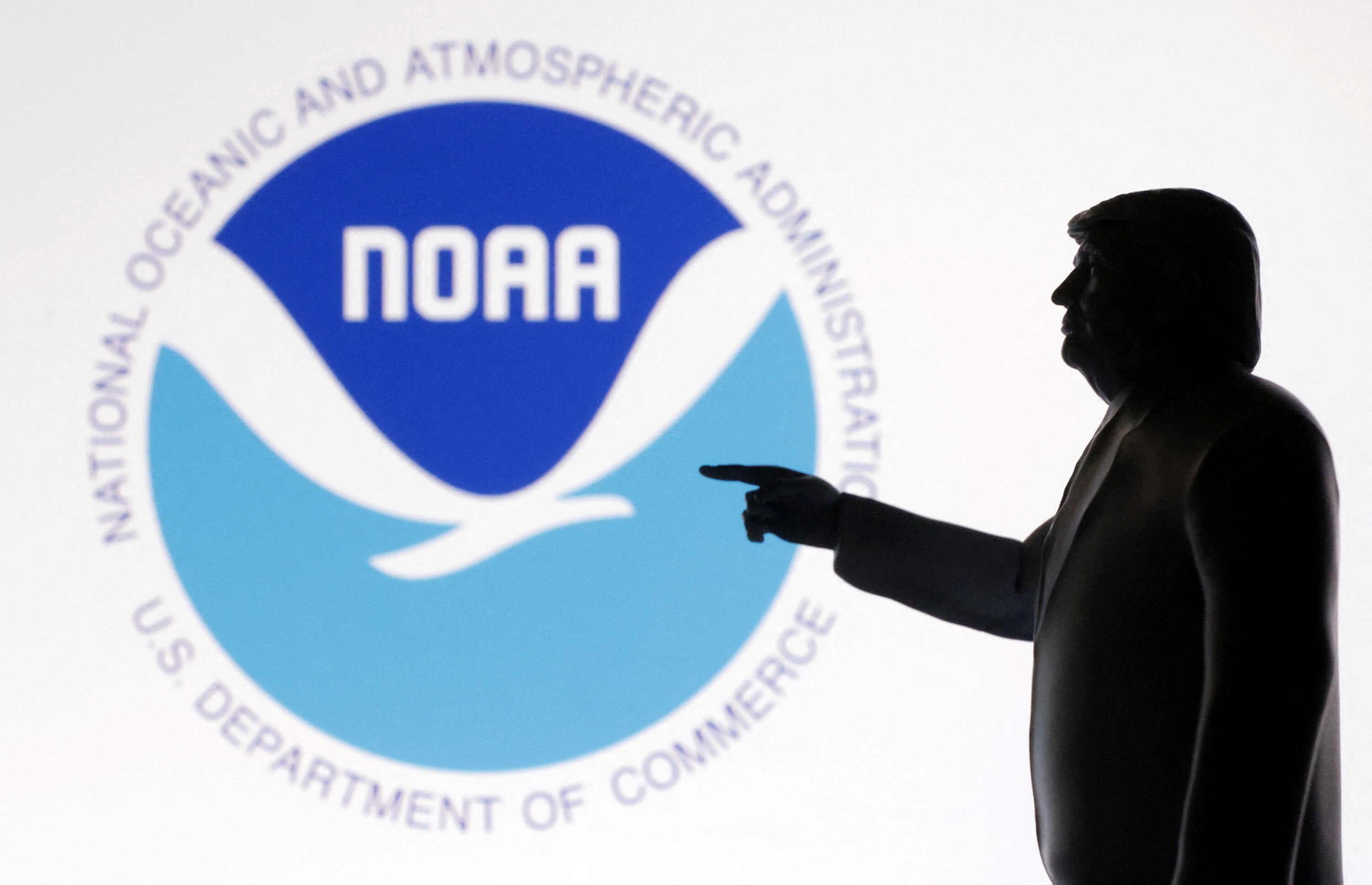A 3D-printed miniature model of US President Donald Trump with the NOAA logo