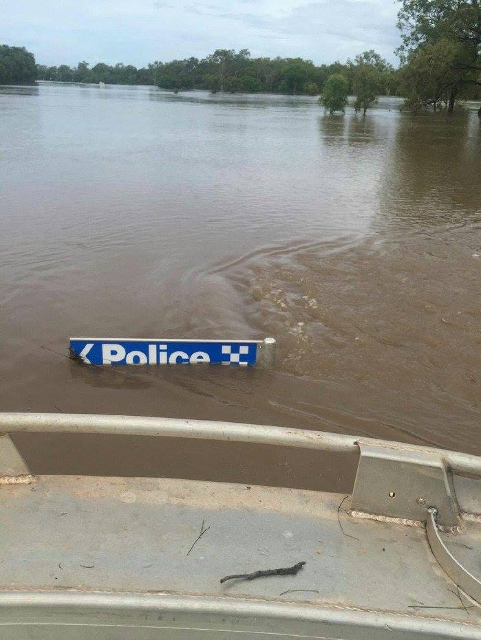 The sign pointing to the Daly River Police Station, during the flood event of December 2015.