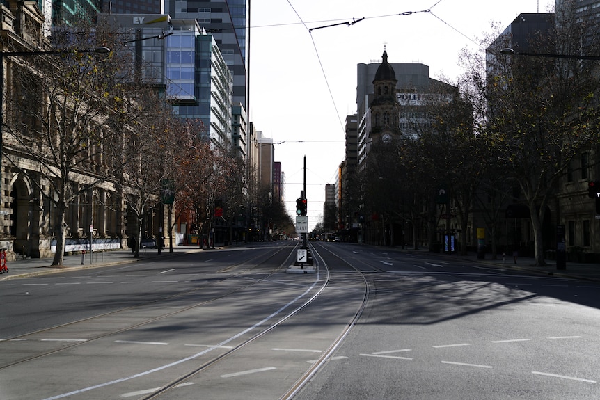 An empty city street with a tram line