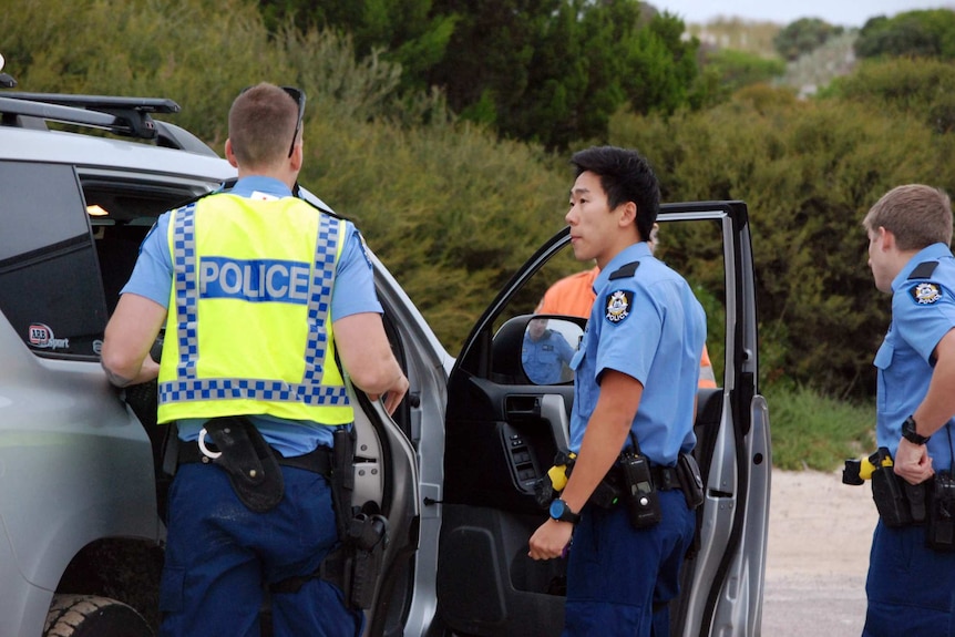 Police at the scene of the fatal shark attack.