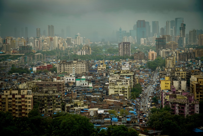 The Dharavi slum in front of the skyscrapers of Mumbai 
