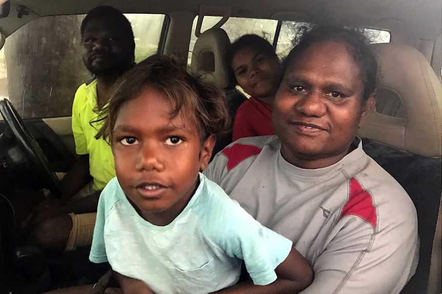 Rachel Puantulura and her family prepare to take shelter from the tropical low on Bathurst Island.