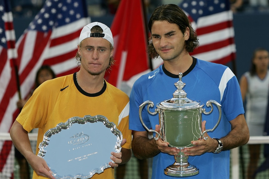 Roger Federer and Lleyton Hewitt with their trophies after the 2004 US Open final.