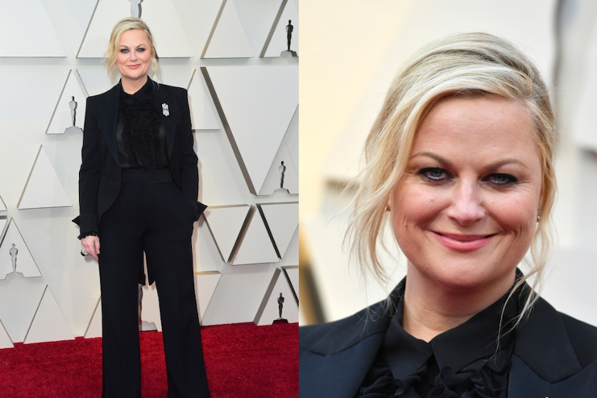 Amy Poehler wears a black suit to the Oscars.