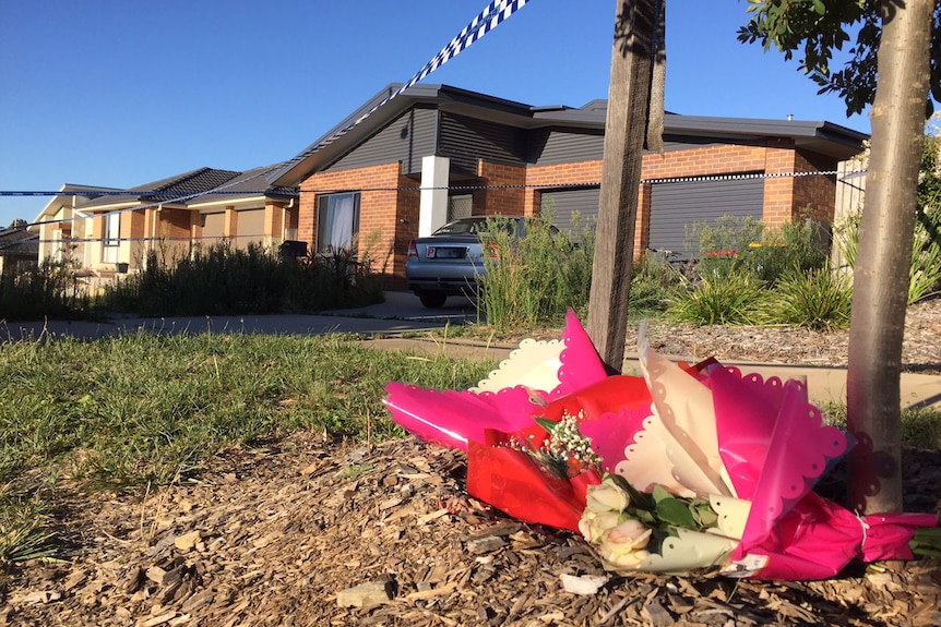 Bunches of flowers have been left outside the home on Bittermann Street in Jacka.