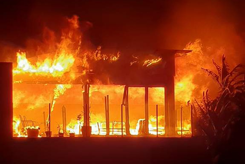 Enormous fire burning through cafe building