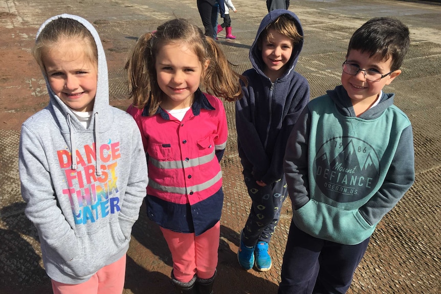 Four Foundation students at a dairy farm.